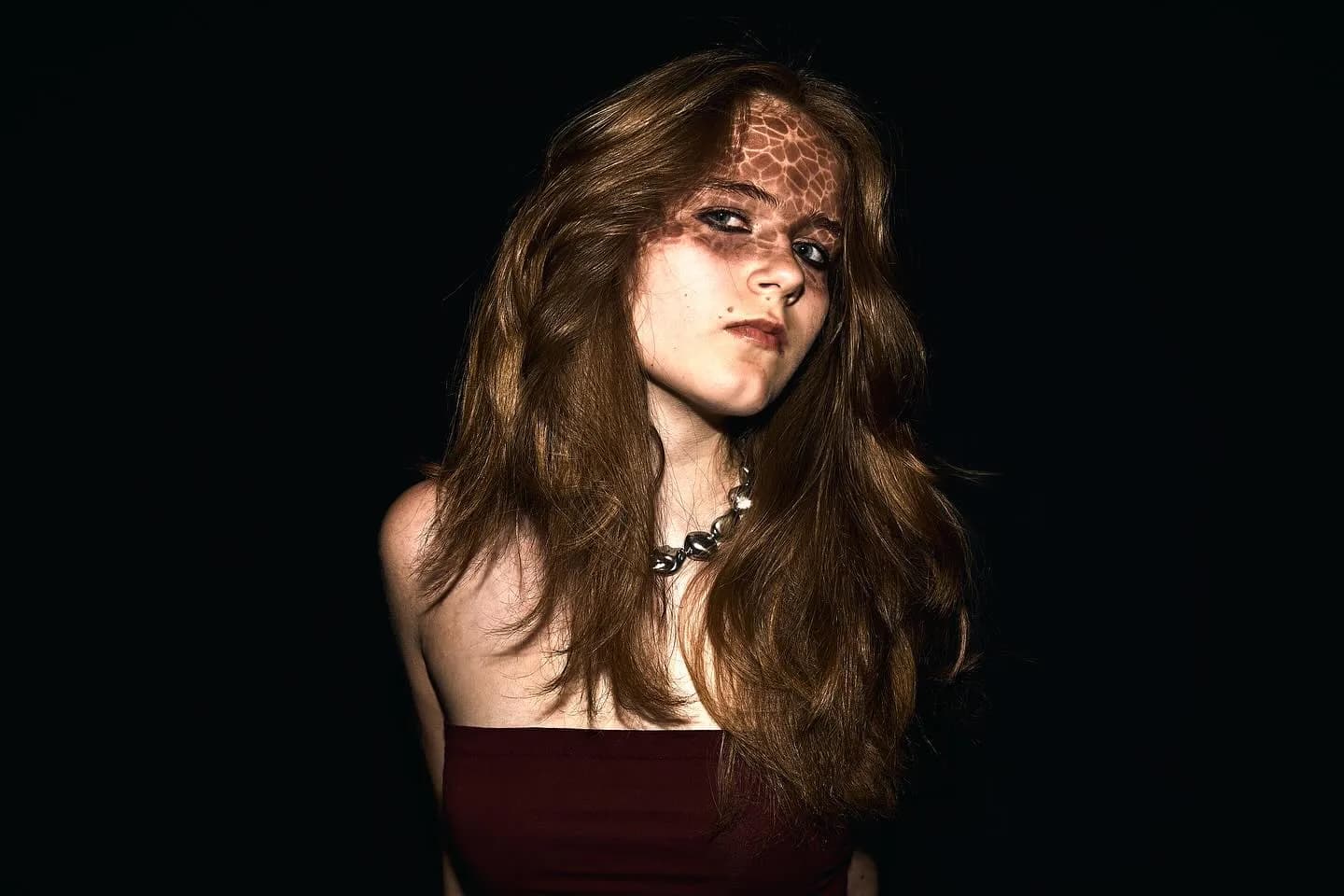 Event photography — a styled portrait captured in dramatic low light